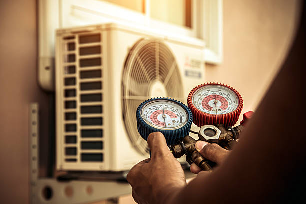 Professional Air Conditioning Service technician working in Poneto, IN